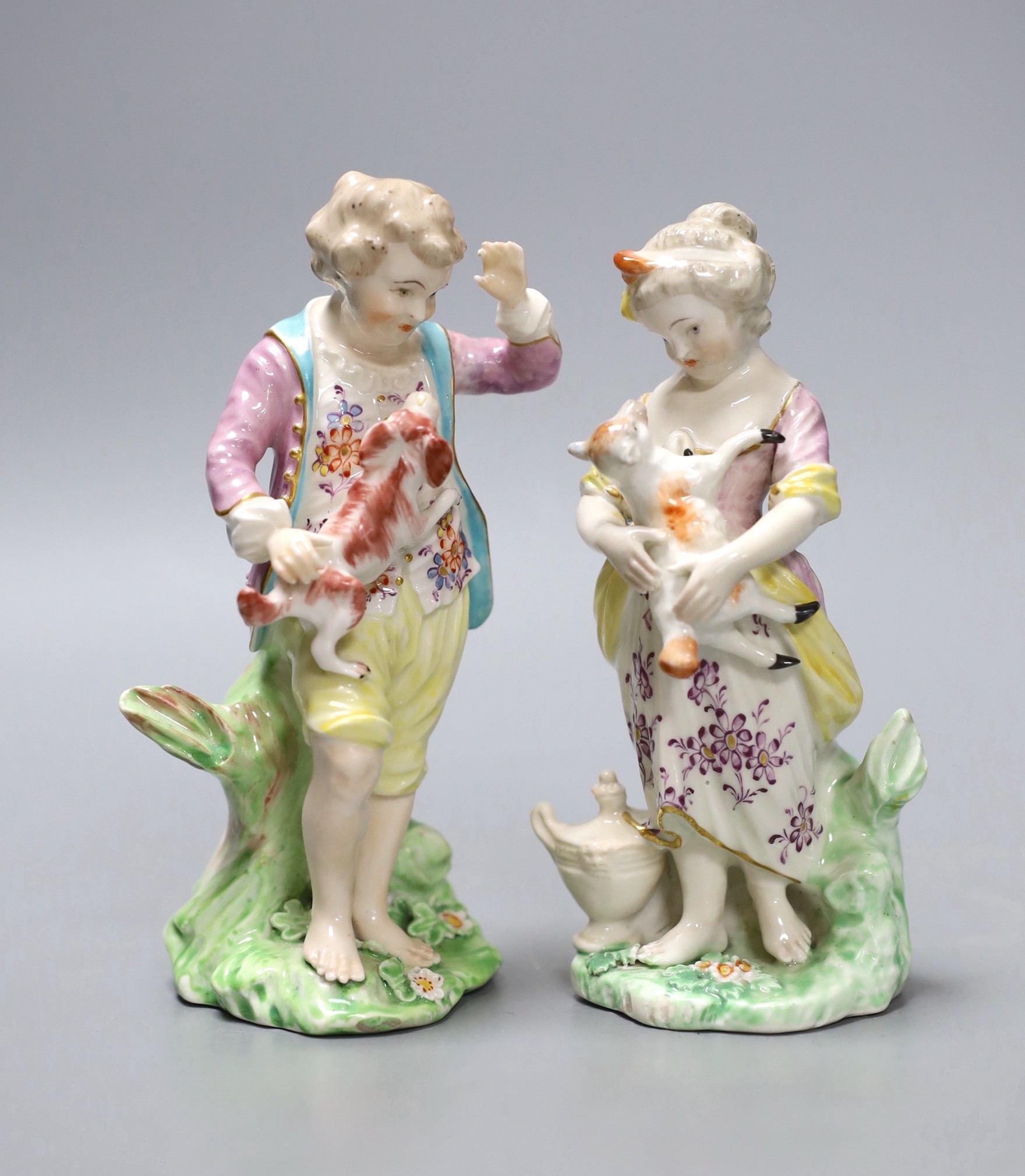 A pair of Chelsea Derby figures of a boy and a girl, she with a lamb and he with a dog, c.1775, 14.5cm